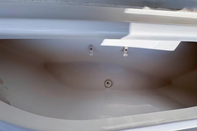 Slide: The Image of 2017 NauticStar 1810 NauticBay storage compartment, open and empty. - 21