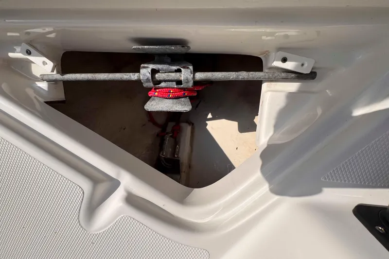 Slide: The Image of 2017 NauticStar 1810 NauticBay boat anchor storage compartment with securing mechanism. - 24