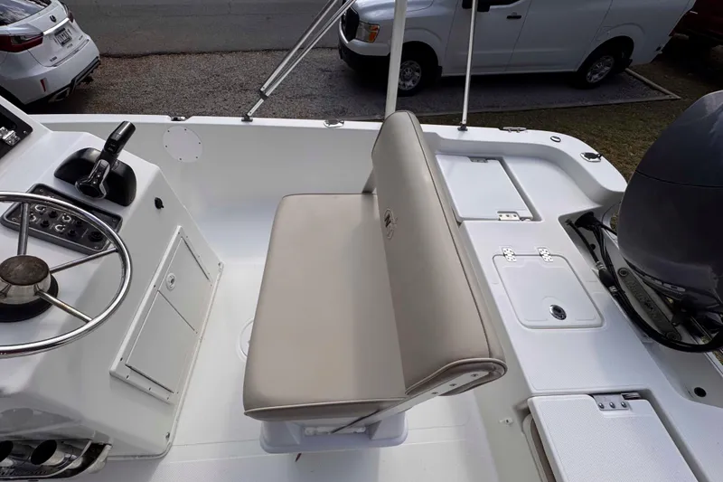 Slide: The Image of 2017 NauticStar 1810 NauticBay boat interior with steering wheel and seating. - 9
