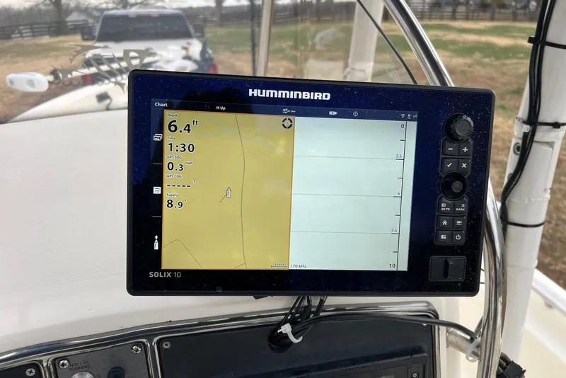 Slide: The Image of Humminbird Solix 10 fishfinder on 2009 Scout 240 Bay Scout boat dashboard. - 15
