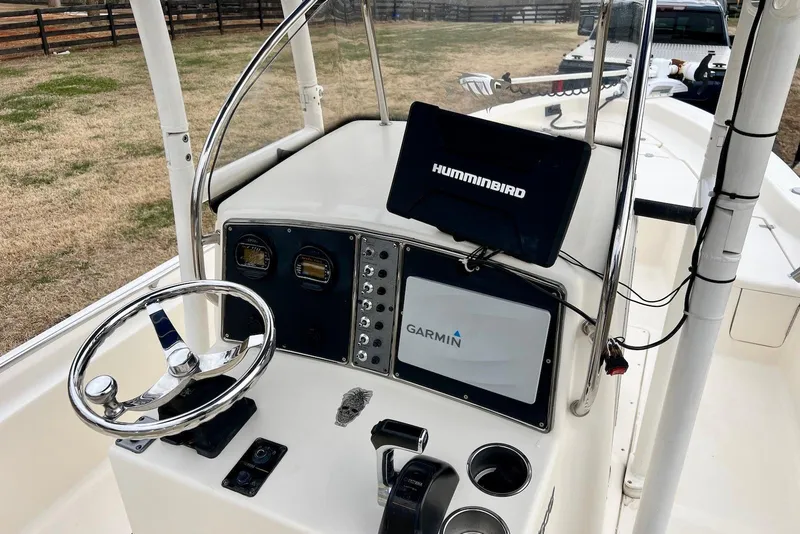 Slide: The Image of 2009 Scout 240 Bay Scout boat dashboard with Garmin and Humminbird electronics. - 19