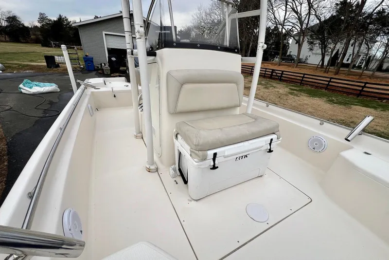 Slide: The Image of 2009 Scout 240 Bay Scout boat interior with seating and storage. - 21