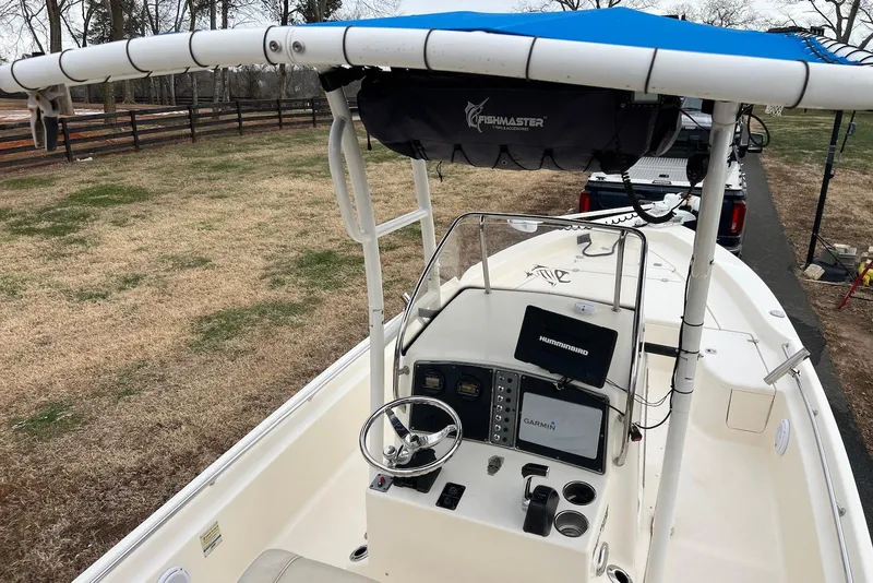 Slide: The Image of 2009 Scout 240 Bay Scout boat with Fishmaster T-top and navigation equipment. - 23