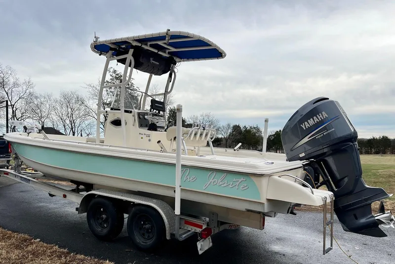 Slide: The Image of 2009 Scout 240 Bay Scout boat on trailer with Yamaha outboard motor. - 4