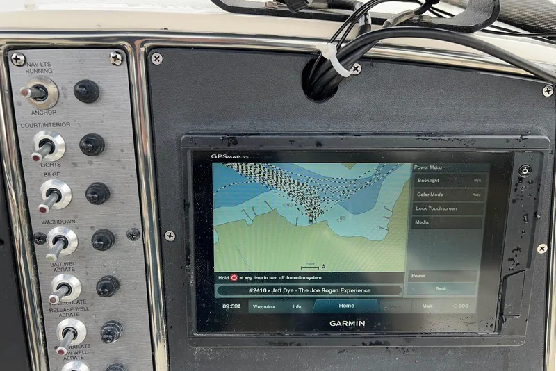 Slide: The Image of Control panel and GPS display on a 2009 Scout 240 Bay Scout boat. - 6