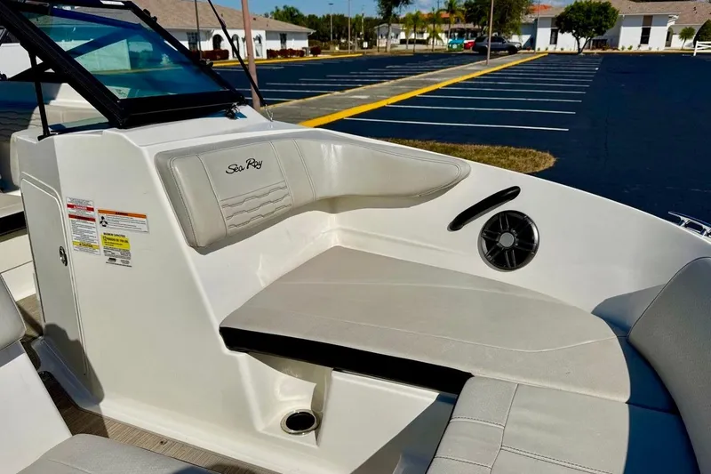 Slide: The Image of 2023 Sea Ray SPX 210 Outboard boat interior with seating and speaker. - 11