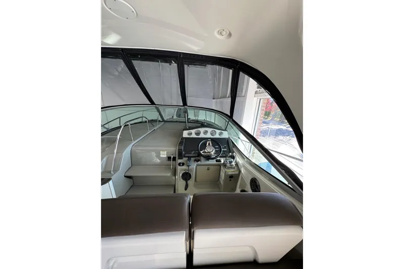 Slide: The Image of 2014 Searay 330 Sundancer interior with stainless steel mini fridge and speaker. - 11