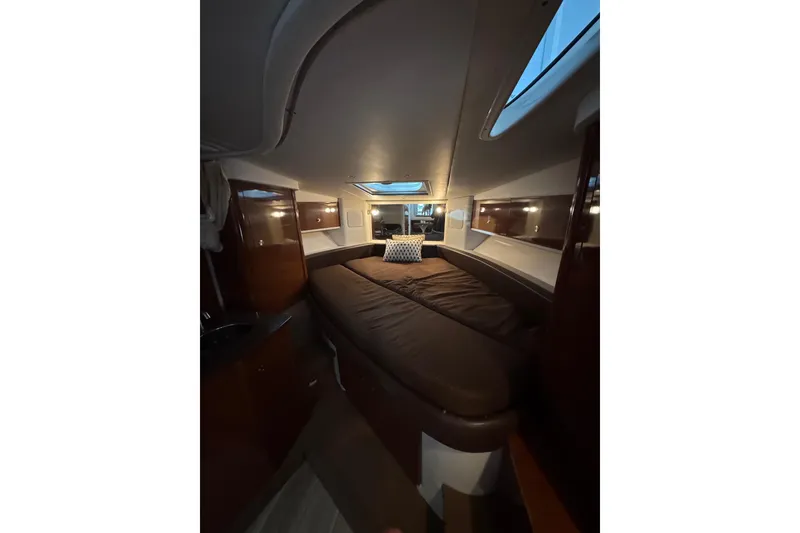 Slide: The Image of Interior of 2014 Searay 330 Sundancer yacht with beige seating and windows. - 20