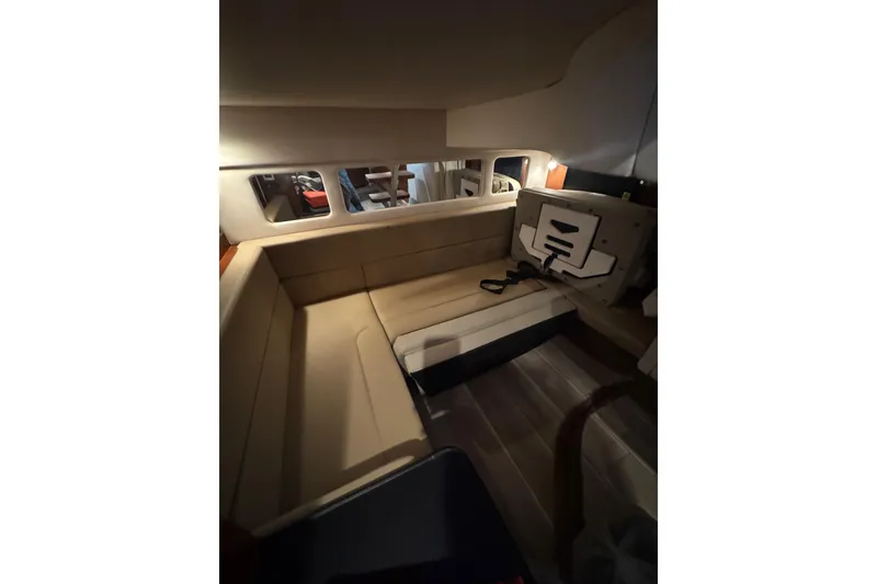 Slide: The Image of Luxurious bathroom in 2014 Searay 330 Sundancer yacht with sink, toilet, and porthole. - 21
