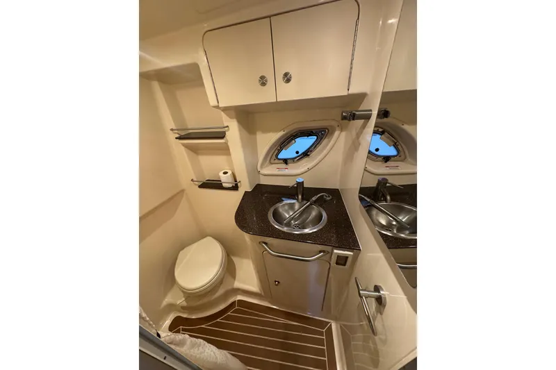 Slide: The Image of Open storage compartment on 2014 Searay 330 Sundancer boat interior. - 22