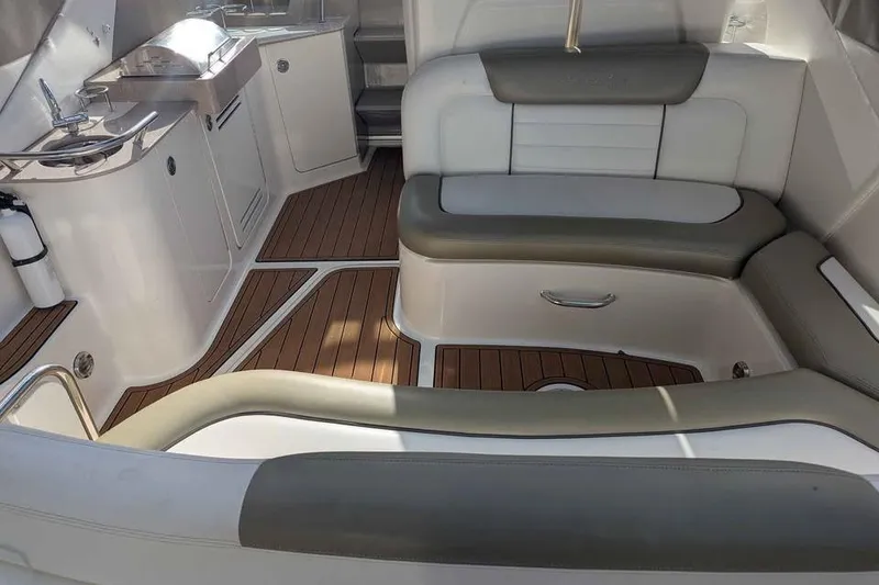 Slide: The Image of 2007 Sea Ray 310 Sundancer interior with elegant seating and teak flooring. - 7