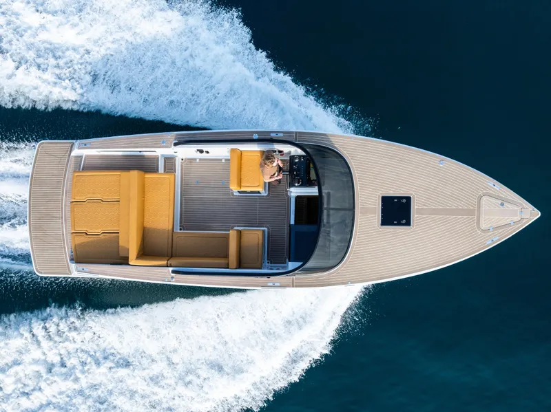 Slide: The Image of 2023 VanDutch 32 luxury yacht cruising on open water, aerial view. - 11
