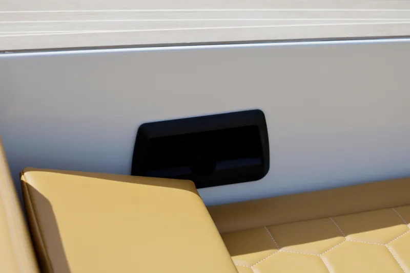 Slide: The Image of VanDutch 32 boat interior, featuring tan leather seating and sleek white paneling, 2023 model. - 15