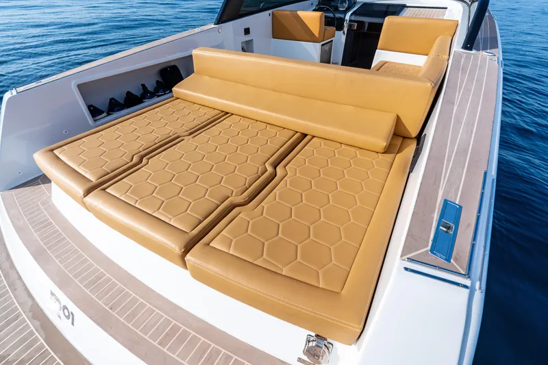 Slide: The Image of 2023 VanDutch 32 yacht with luxurious tan leather seating on open water. - 17