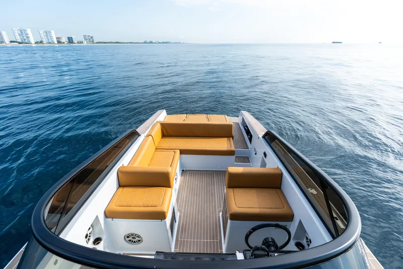 Slide: The Image of 2023 VanDutch 32 yacht with tan seating, cruising on open water. - 28