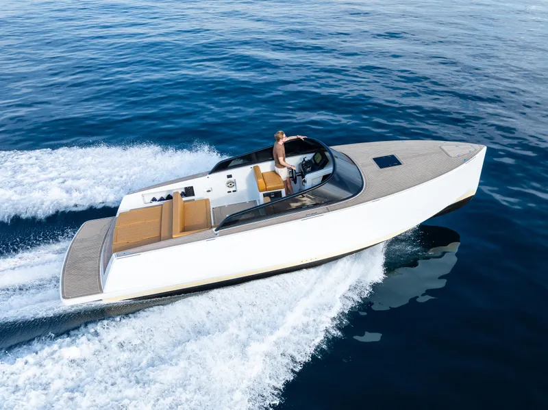 Slide: The Image of 2023 VanDutch 32 yacht cruising on open water, showcasing sleek design and luxury features. - 3