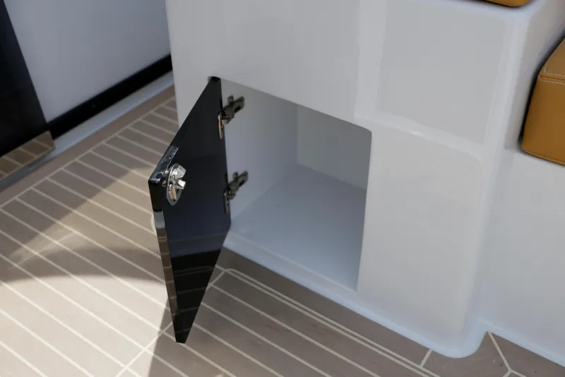 Slide: The Image of Open storage compartment on 2023 VanDutch 32 yacht, featuring sleek design and modern finish. - 30