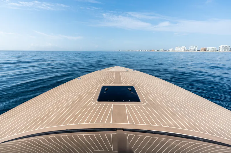 Slide: The Image of VanDutch 32 yacht bow on open sea, 2023 model, clear blue sky. - 39