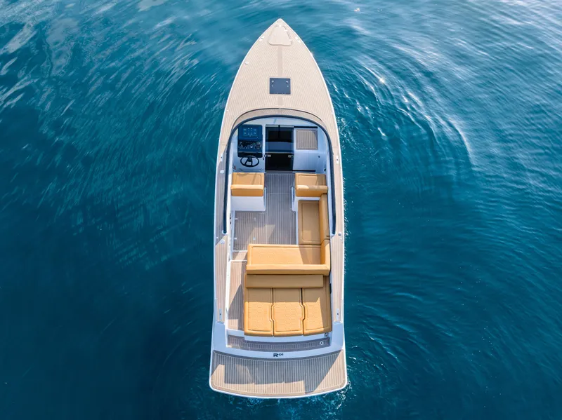 Slide: The Image of 2023 VanDutch 32 luxury boat on clear blue water, aerial view. - 4