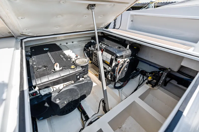 Slide: The Image of Engine compartment of 2023 VanDutch 32 yacht, showcasing modern mechanical components. - 41