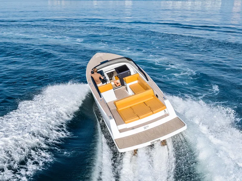 Slide: The Image of 2023 VanDutch 32 yacht cruising on open water, featuring sleek design and luxurious seating. - 6