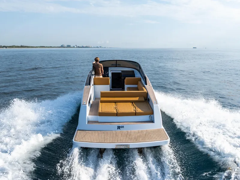 Slide: The Image of 2023 VanDutch 32 yacht cruising on open water, showcasing sleek design and luxury. - 7