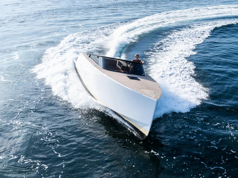 Slide: The Image of 2023 VanDutch 32 yacht cruising swiftly on open water. - 9