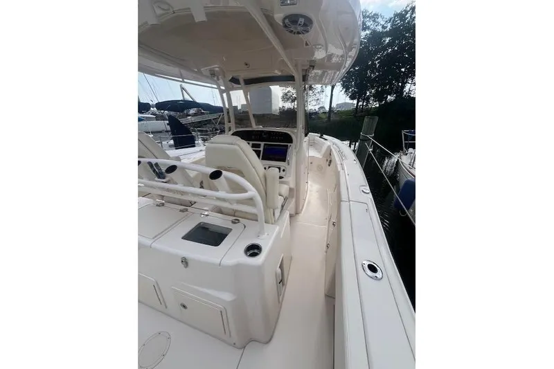 Slide: The Image of 2023 Grady-White Canyon 306 boat interior with helm and seating area. - 21