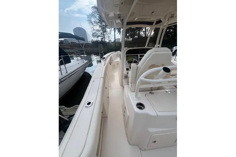 Slide: The Image of 2023 Grady-White Canyon 306 boat interior with helm and seating area. - 22