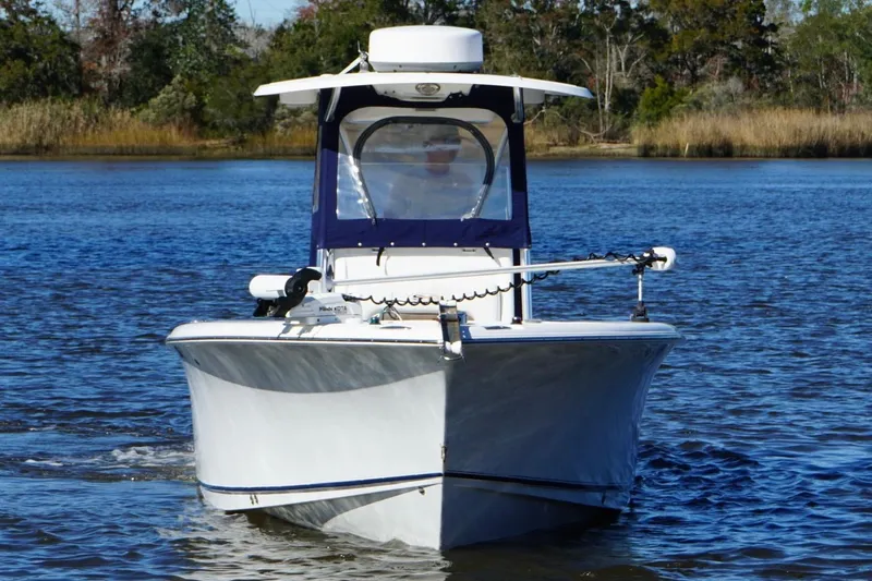 Slide: The Image of 2011 Sea Hunt Gamefish 25 boat on calm water, front view. - 4