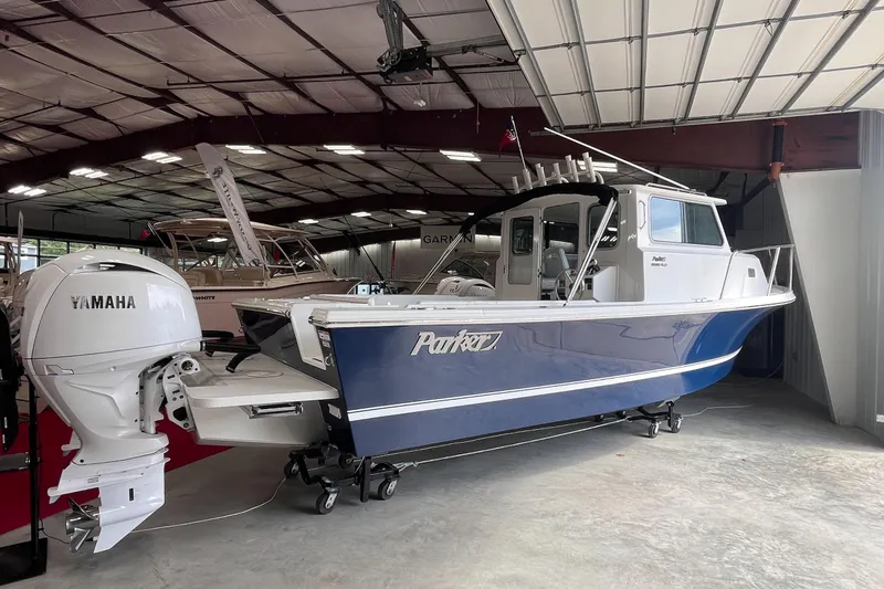Slide: The Image of 2026 Parker 2520 XLD Sport Cabin boat with Yamaha engine in showroom. - 3