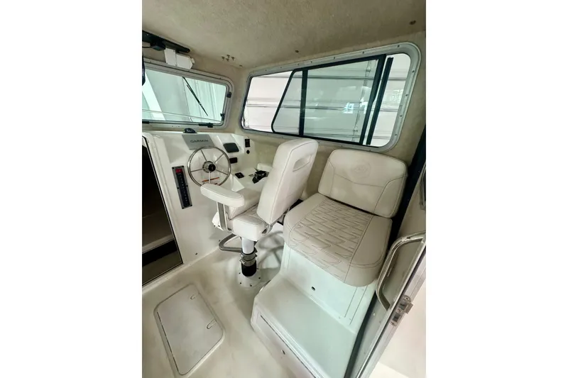 Slide: The Image of Interior of 2026 Parker 2520 XLD Sport Cabin with steering wheel and seating. - 9