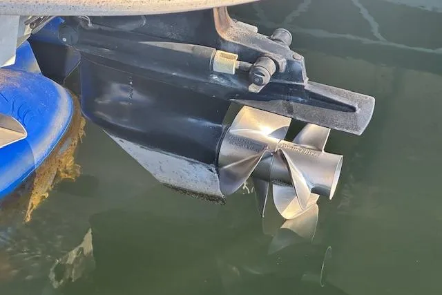 Slide: The Image of Propeller of 2002 Sea Ray 240 Sundeck boat submerged in water. - 21