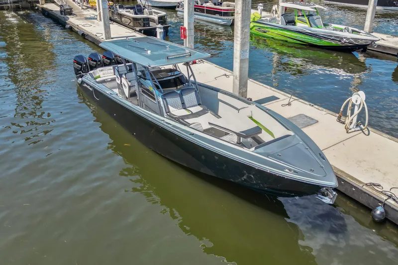 The Image of 2021 Nor-Tech 390 Sport Center Console boat docked at marina. - 0