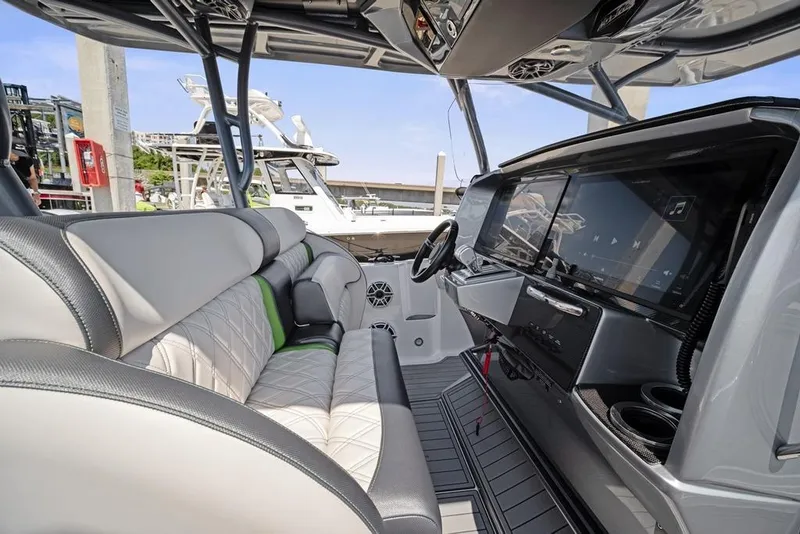 Slide: The Image of 2021 Nor-Tech 390 Sport Center Console interior with modern dashboard and seating. - 18