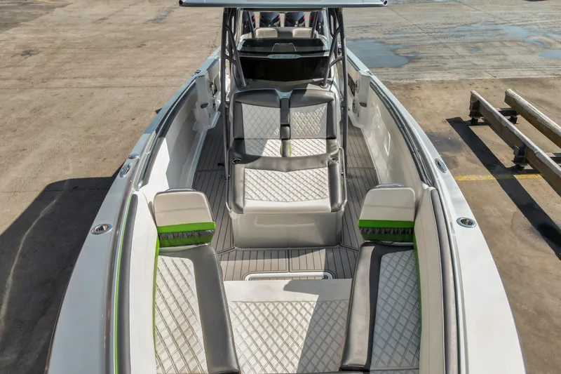 Slide: The Image of 2021 Nor-Tech 390 Sport Center Console boat with sleek seating and modern design. - 3