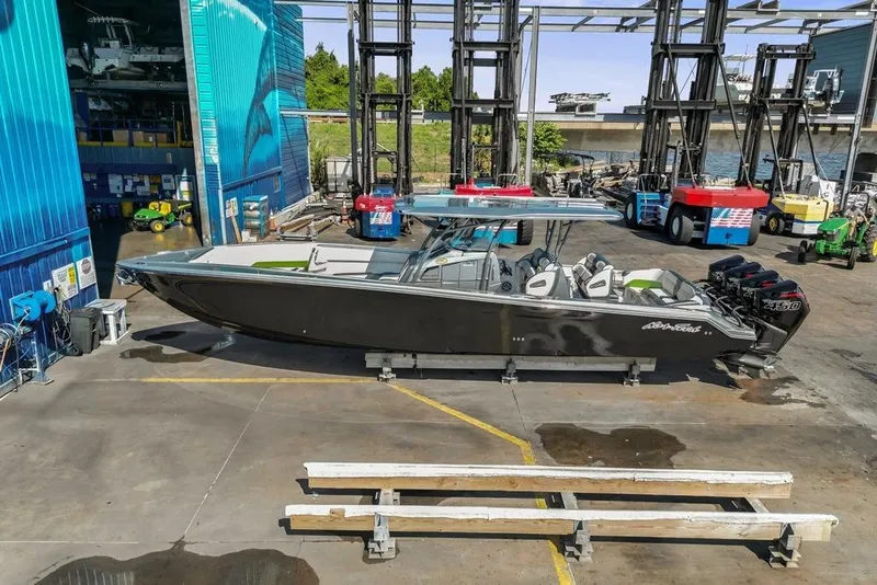 Slide: The Image of 2021 Nor-Tech 390 Sport Center Console boat in a marina setting. - 35