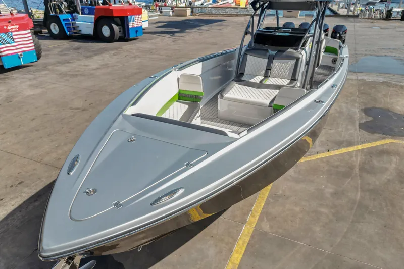 Slide: The Image of 2021 Nor-Tech 390 Sport Center Console boat docked, showcasing sleek design and spacious seating. - 4