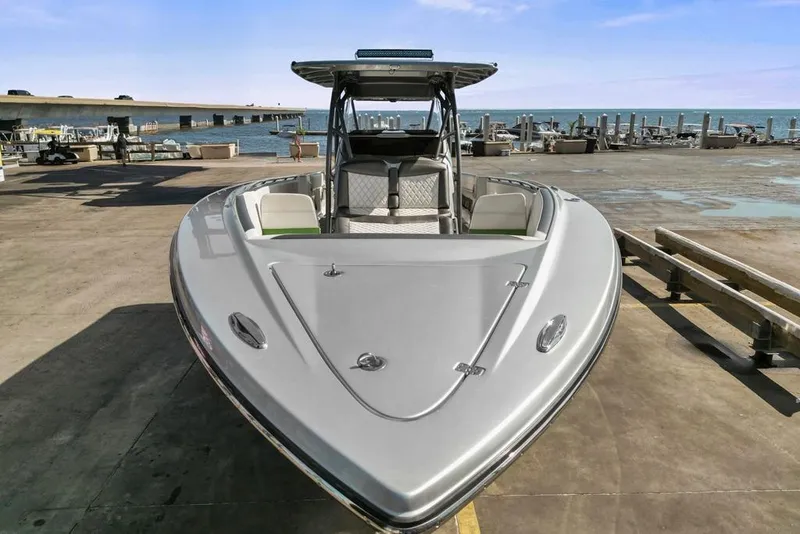 Slide: The Image of 2021 Nor-Tech 390 Sport Center Console boat docked at marina. - 41