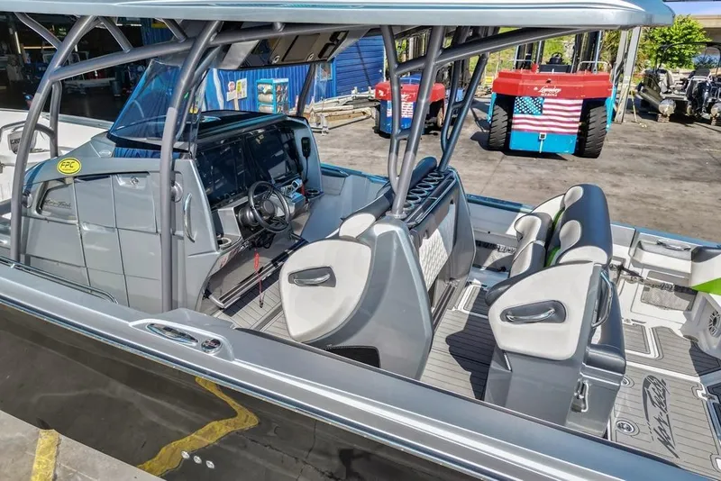 Slide: The Image of 2021 Nor-Tech 390 Sport Center Console boat interior with modern seating and steering console. - 43