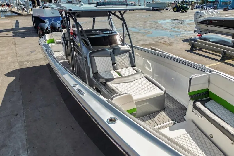 Slide: The Image of 2021 Nor-Tech 390 Sport Center Console boat with sleek design and spacious seating. - 54