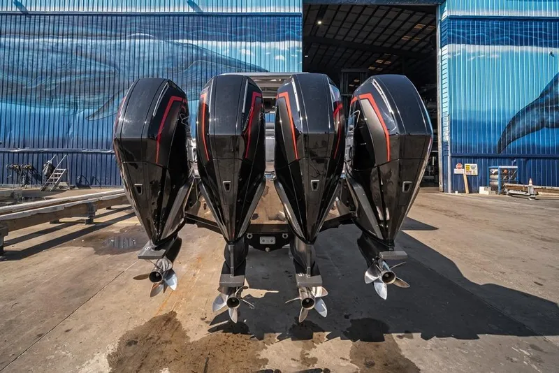 Slide: The Image of 2021 Nor-Tech 390 Sport Center Console with four powerful outboard engines. - 9