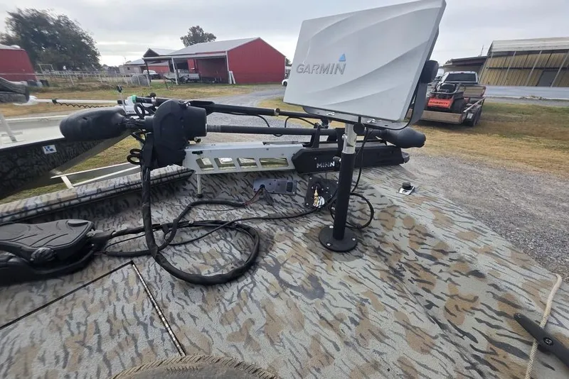 Slide: The Image of 2022 Xpress XP200 Catfish boat with Garmin fishfinder and trolling motor on deck. - 11