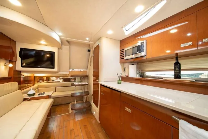 Slide: The Image of Luxurious interior of 2010 Sea Ray 370 Sundancer yacht with modern amenities and elegant design. - 5