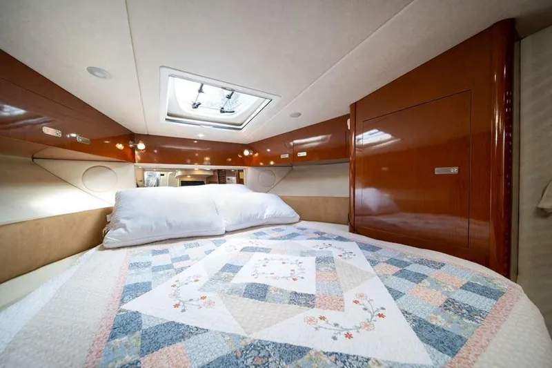 Slide: The Image of Luxurious cabin interior of 2010 Sea Ray 370 Sundancer with quilted bedding. - 6