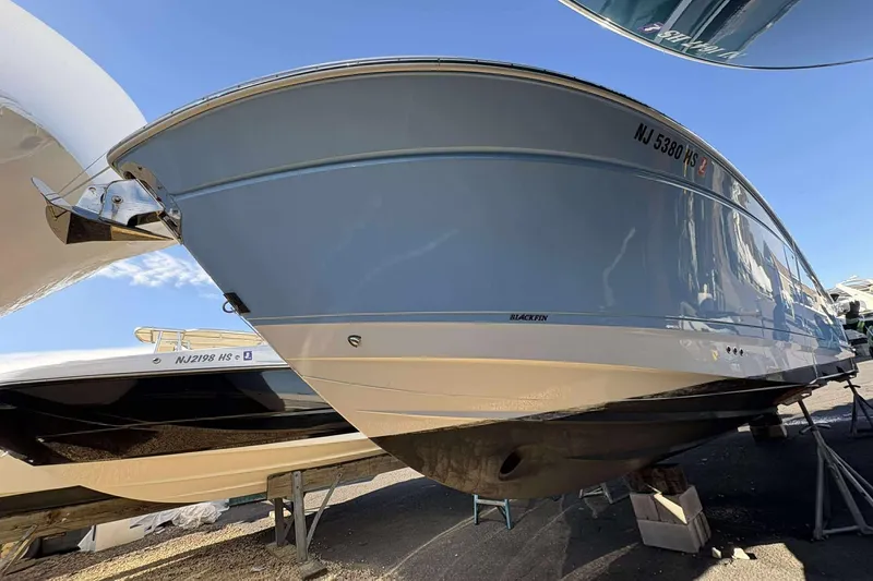 Slide: The Image of 2024 Blackfin 302CC boat on display, showcasing sleek design and modern features. - 4