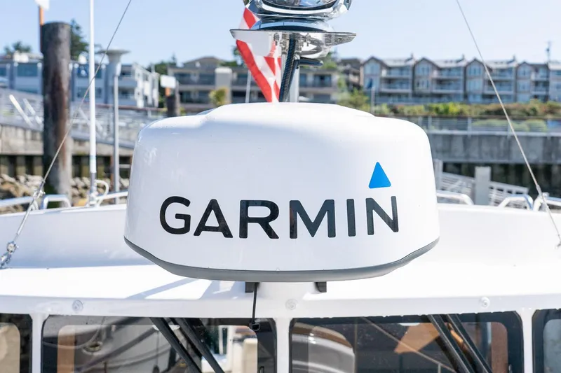 Slide: The Image of Garmin radar on 2026 Ranger Tugs R-31S boat docked at marina. - 10