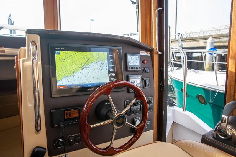 Slide: The Image of Helm of 2026 Ranger Tugs R-31S with navigation display and controls. - 28
