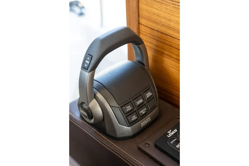 Slide: The Image of Control panel of 2026 Ranger Tugs R-31S boat with various function buttons. - 41