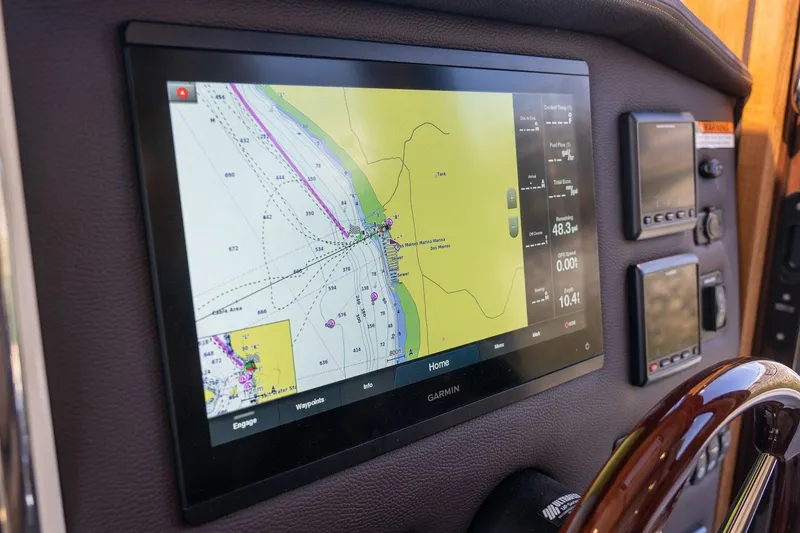 Slide: The Image of Navigation display on 2026 Ranger Tugs R-31S boat, featuring Garmin marine electronics. - 42